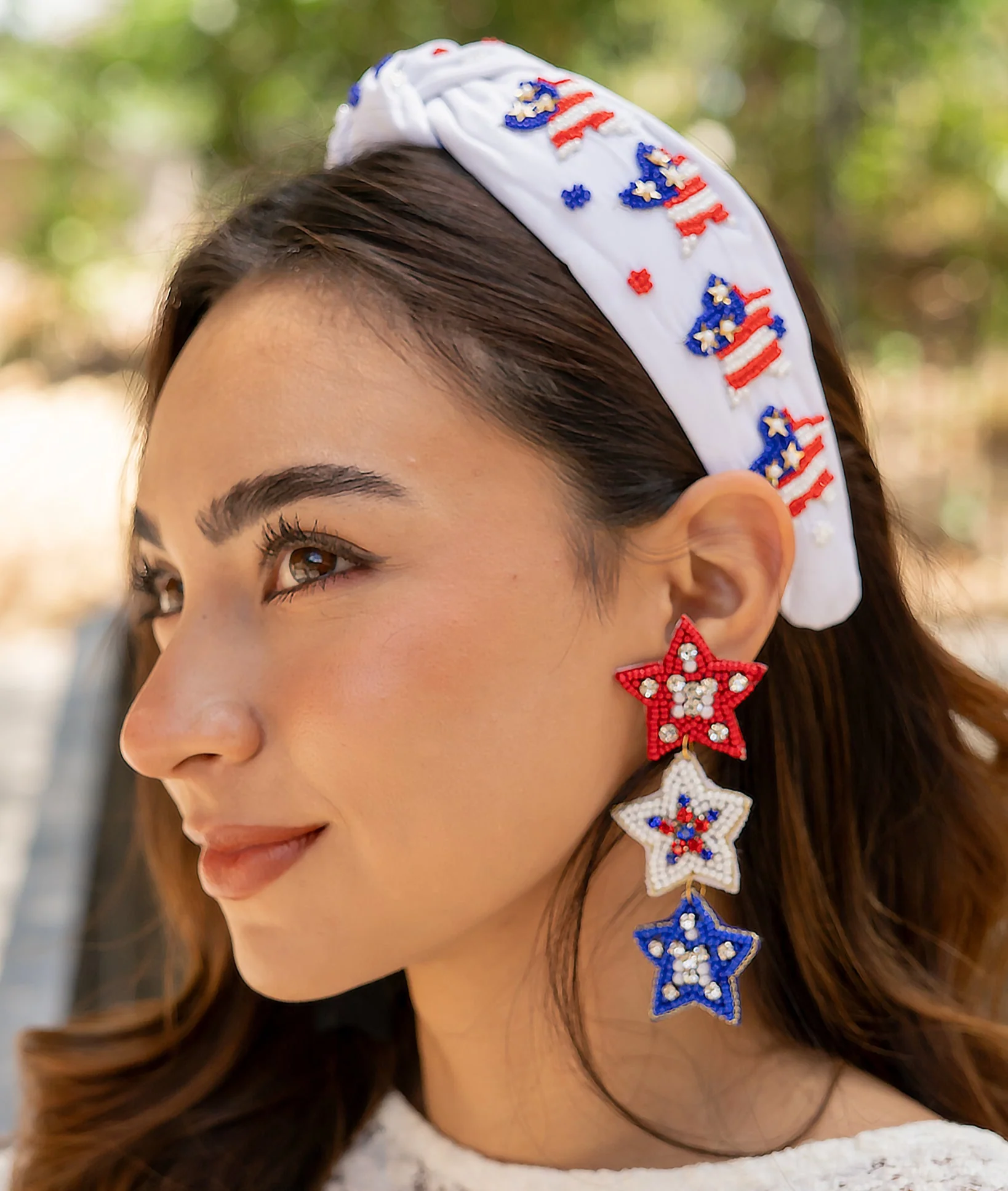 How do these earrings give back to the community?